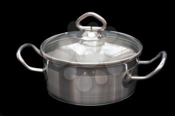 Saucepan, made of stainless steel with handle,cover, on black background.
