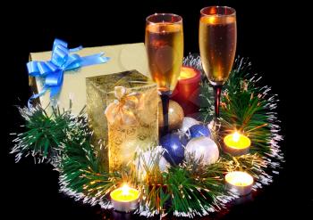 Christmas and New Year decoration- balls, tinsel, candel and glasses of champagne .On black background.