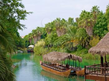 landscape and walking canoe on river in French Polynesia.