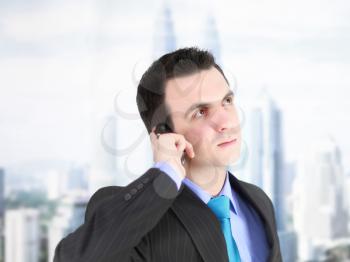 European businessman with cell phone. Isolated over white