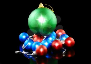 Christmas and New Year decoration-coloured balls. On the black background.