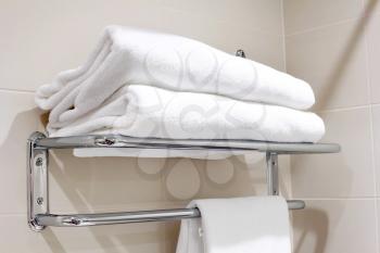 Clean white towel on a hanger