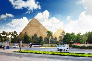 Ancient Great Pyramids and present day of Giza town,suburb of Cairo city. Egypt.