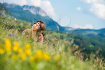 beautiful woman lying on the grass