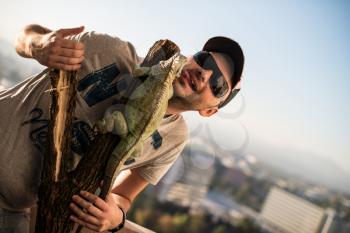 portrait of the young man with the iguana