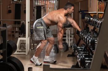 Mexican Bodybuilder Doing Heavy Weight Exercise For Back With Dumbbells