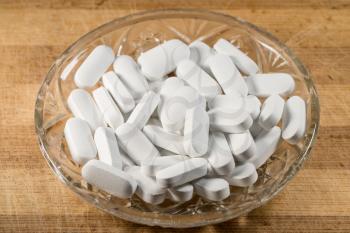White Pills In A Glass Bowl