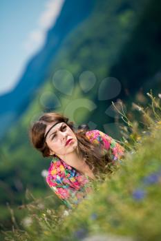 beautiful woman lying on the grass