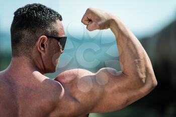 Man Athlete Showing Biceps