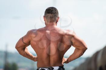 Man Showing Off His Back