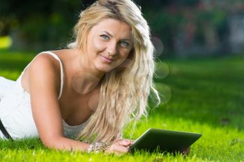 Woman Using Tablet Outdoors