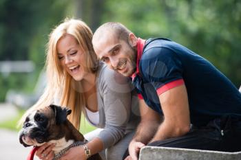 Happy Couple With German Boxer