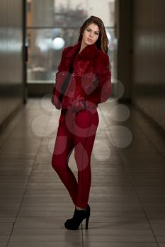 Glamour Fashion Model Wearing Red Pants And Jacket