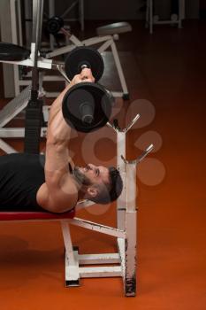 Muscular Man Exercising Triceps