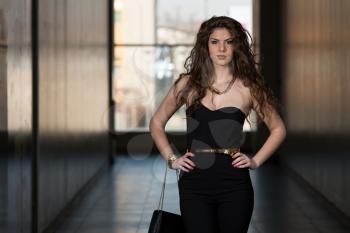 Fashion Portrait Of Young Girl With A Bag