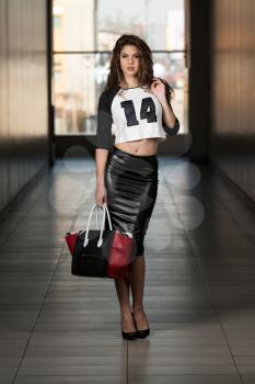 Fashion Portrait Of Young Girl With A Bag
