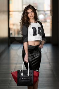 Fashion Model Wearing Black Leather Skirt