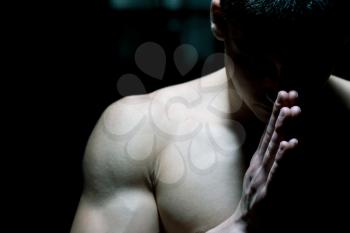 Muscular Man Praying