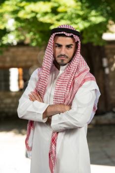 Young Businessman Wearing A Traditional Cap Dishdasha