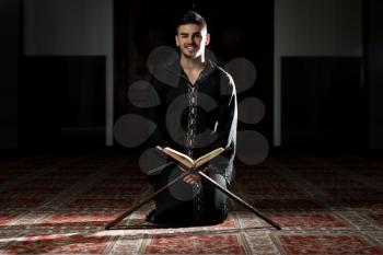 Arabic Muslim Man Reading Holy Islamic Book Koran