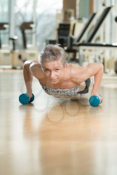 Beautiful Fit Woman Doing Push-ups In Healthy Club