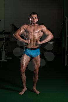 Body Builder Performing Front Lat Spread Poses