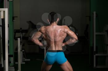 Body Builder Performing Back Lat Spread Poses
