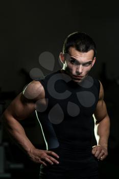 A Muscular Male Model Staring Confidently