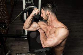 Athlete Man Doing Heavy Weight Exercise For Biceps