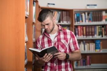 A Portrait Of An Caucasian College Student Man In Library - Shallow Depth Of Field