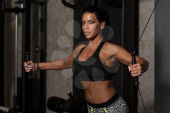 Young Woman Is Working On Her Chest With Cable Crossover In A Modern Gym