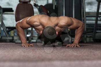 Young Adult Athlete Doing Push Ups As Part Of Bodybuilding Training