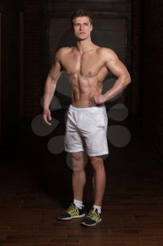 Portrait Of A Young Physically Fit Man Showing His Well Trained Body