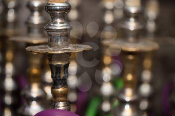 Close-up Of Several Hookahs Lined Up In A Cafe Bar