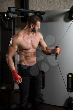 Young Man Is Working On His Chest With Cable Crossover In A Modern Fitness Gym