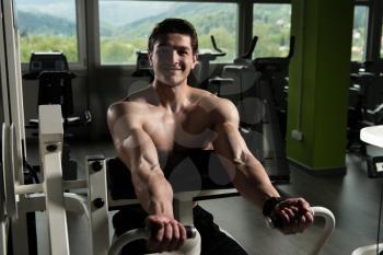 Biceps Exercise Machine - Young Bodybuilder Doing Heavy Weight Exercise For Bicep In The Gym