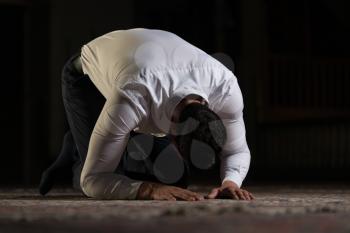 Adult Muslim Man Is Praying In The Mosque