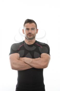 Handsome Personal Trainer Wearing Sportswear Isolated On A White Background