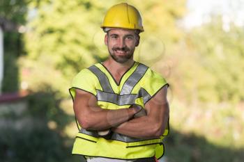 Successful Male Architect At A Building Site With Arms Crossed