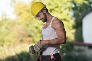 Successful Male Architect At A Building Site With Gloves Takes Off