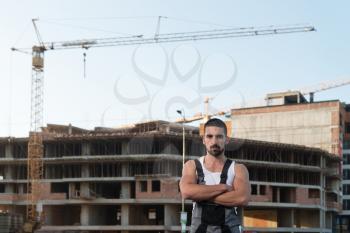 Successful Male Architect At A Building Site With Arms Crossed