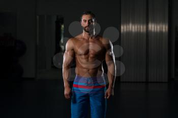 Portrait Of A Young Physically Fit Man Showing His Well Trained Body - Muscular Latin Athletic Bodybuilder Fitness Model Posing After Exercises