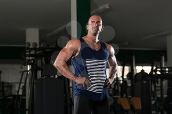 Portrait Of A Physically Fit Man Showing His Well Trained Body - Muscular Athletic Bodybuilder Fitness Model Posing After Exercises