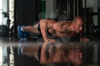 Healthy Athlete Doing Push Ups As Part Of Bodybuilding Training