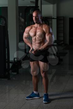 Portrait Of A Young Physically Fit Man Showing His Well Trained Body - Muscular Athletic Bodybuilder Fitness Model Posing After Exercises