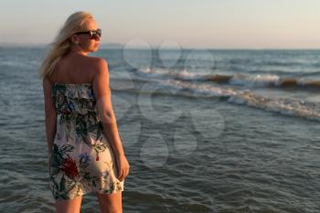 Young Woman Standing By Sea And Looking To Horizon Summer Holidays Vacation Travel
