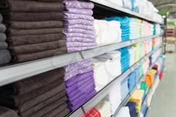 Big Shelf With a Colorful Stack Towels