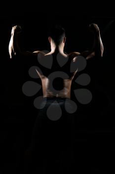 Silhouette Portrait Of A Young Physically Fit Man Showing His Well Trained Body - Muscular Athletic Bodybuilder Fitness Model Posing After Exercises