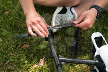 Closeup of Young Engineer Tightening Propeller of Uav Drone With Hand Tool in Park