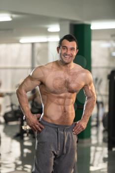 Portrait Of A Young Physically Fit Hairy Man Showing His Well Trained Body - Muscular Athletic Bodybuilder Fitness Model Posing After Exercises